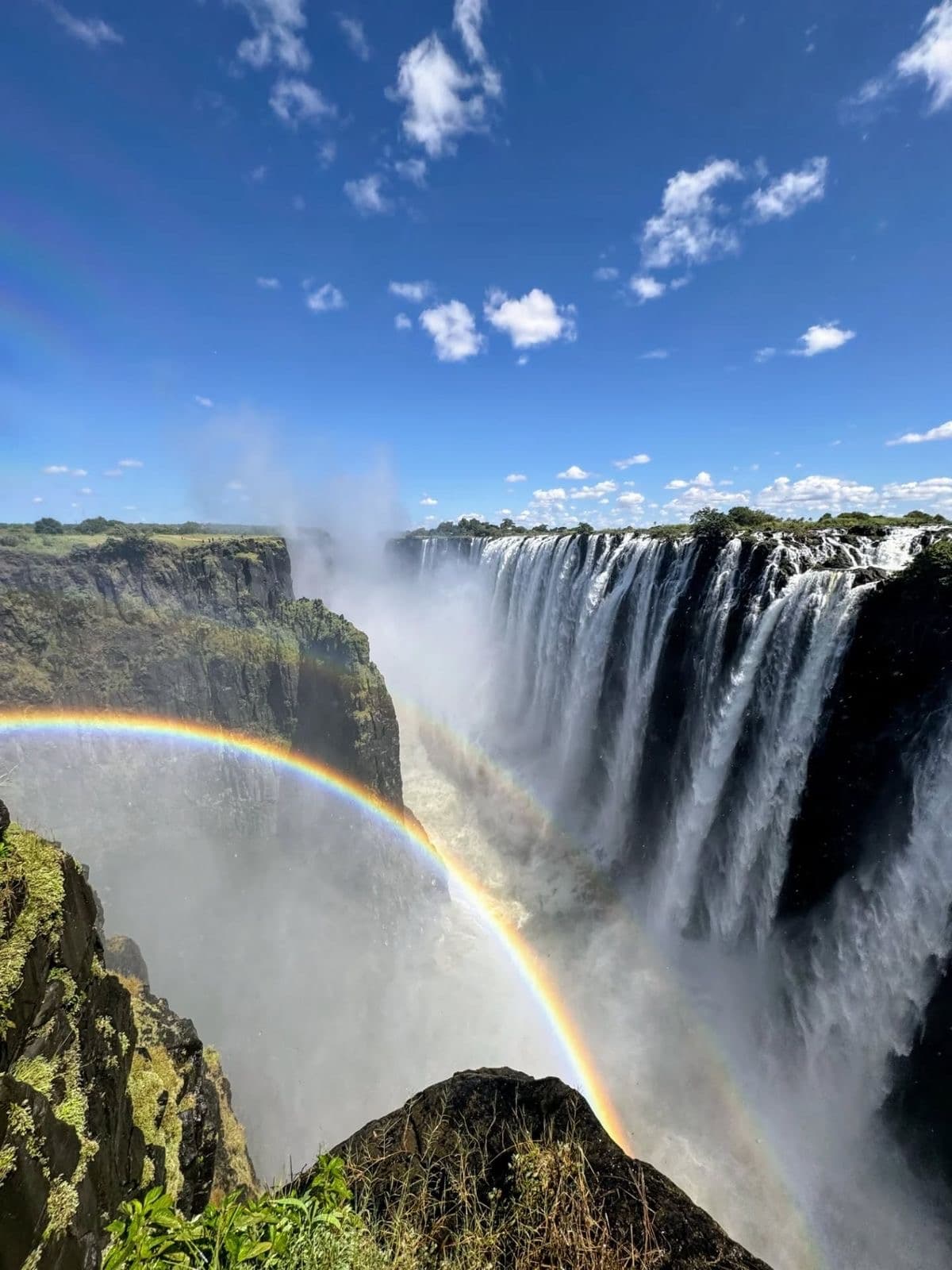 Victoria Falls — rainbow over the gorge